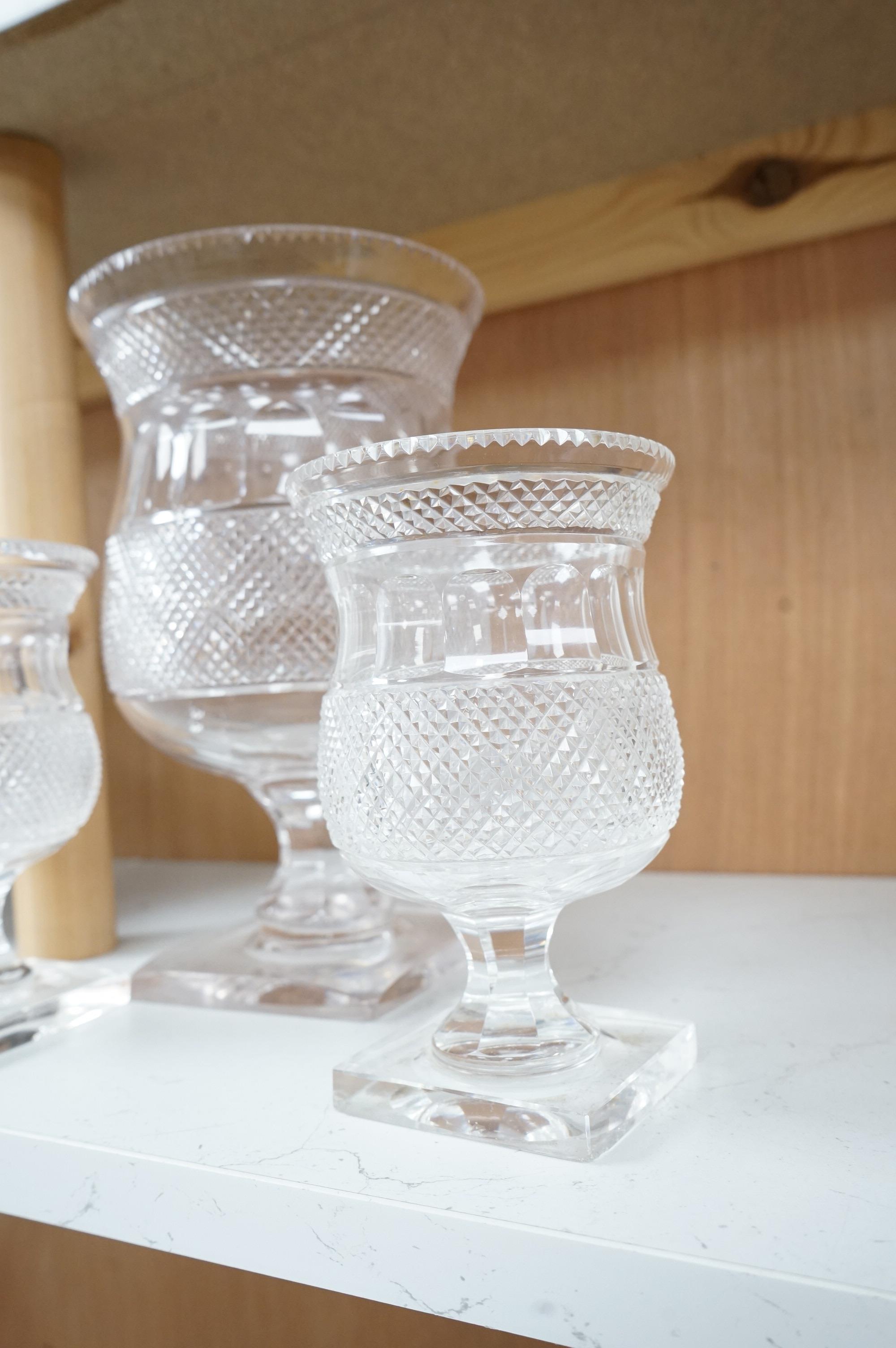 A garniture of three 19th century cut glass vases, largest 26cm high